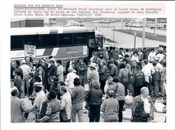 Workers board a Greyhound in Southgate